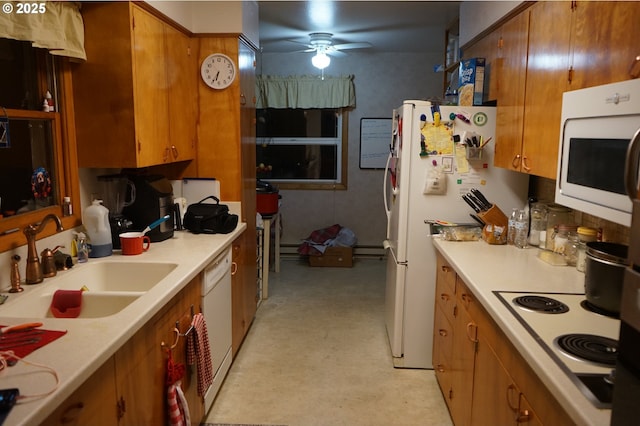 kitchen featuring ceiling fan, white appliances, and sink