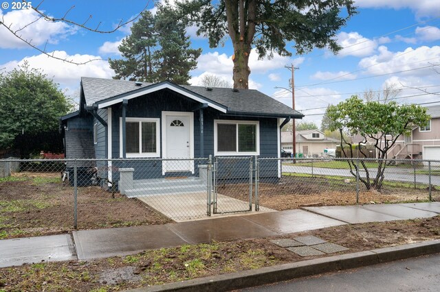 10304 SE Yukon St, Portland, OR 97266 - view of front facade featuring a shingled roof