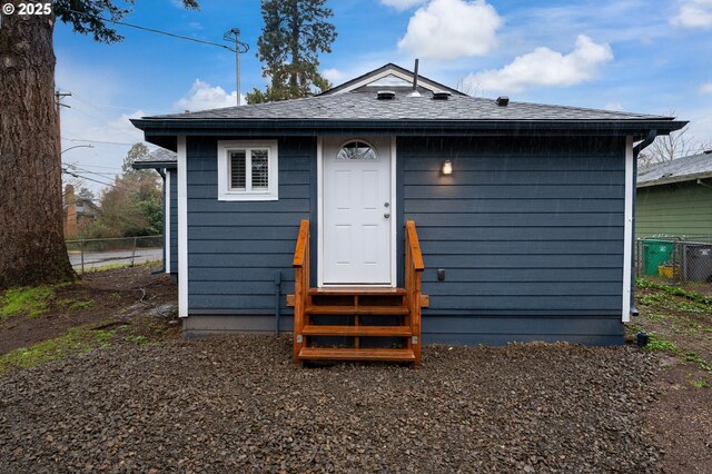 10304 SE Yukon St, Portland, OR 97266 - back of property featuring entry steps and roof with shingles