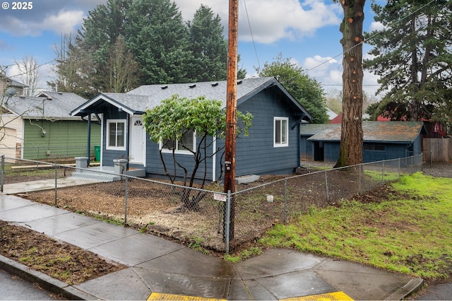 10304 SE Yukon St, Portland, OR 97266 - view of front of home with a fenced front yard and roof with shingles