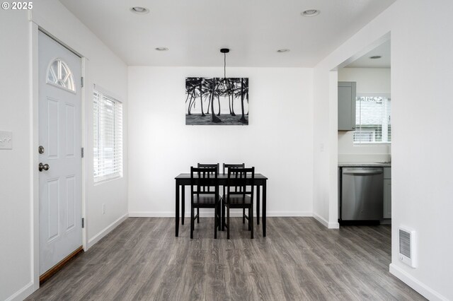 10304 SE Yukon St, Portland, OR 97266 - dining space with wood finished floors, a chandelier, baseboards, and recessed lighting