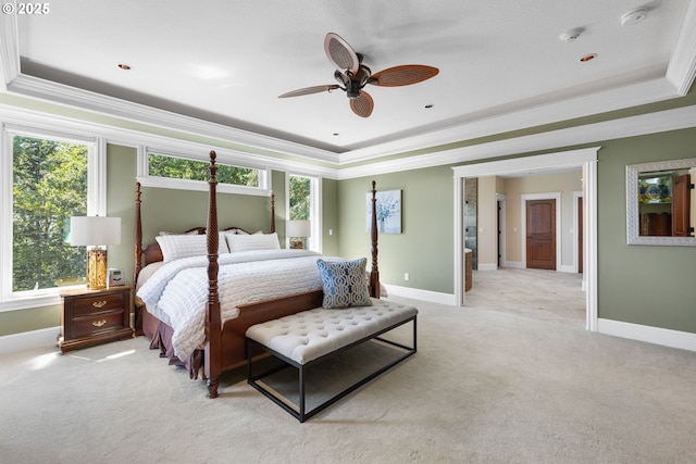 16155 NE Wilkerson Way, Newberg, OR 97132 - bedroom featuring a tray ceiling, light colored carpet, ornamental molding, and multiple windows