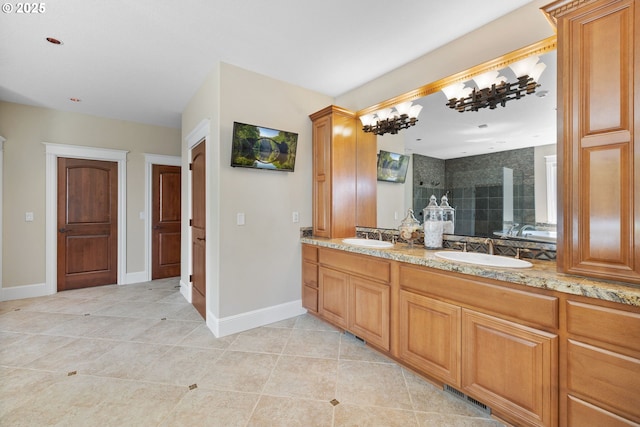 16155 NE Wilkerson Way, Newberg, OR 97132 - bathroom featuring double vanity, tile patterned flooring, baseboards, and a sink