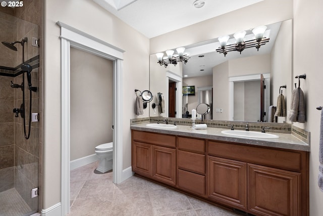 16155 NE Wilkerson Way, Newberg, OR 97132 - full bathroom featuring a sink, double vanity, toilet, and a stall shower