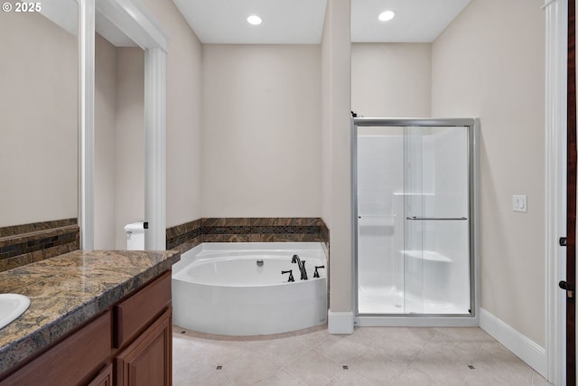 16155 NE Wilkerson Way, Newberg, OR 97132 - full bath with a garden tub, baseboards, a shower stall, tile patterned flooring, and vanity