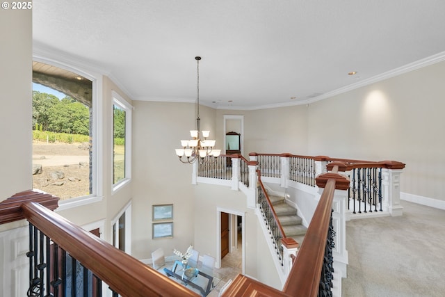16155 NE Wilkerson Way, Newberg, OR 97132 - stairway featuring a chandelier, crown molding, carpet floors, and baseboards