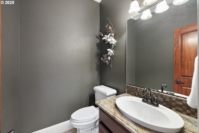16155 NE Wilkerson Way, Newberg, OR 97132 - half bath featuring toilet, vanity, and decorative backsplash