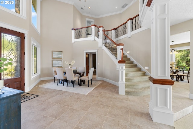 16155 NE Wilkerson Way, Newberg, OR 97132 - foyer entrance with visible vents, light tile patterned flooring, stairs, a chandelier, and ornate columns