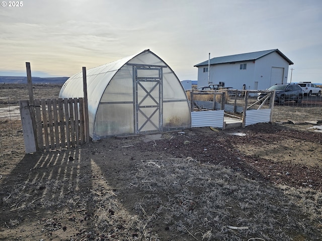 view of outdoor structure at dusk