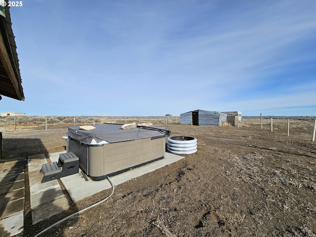 view of yard with a hot tub