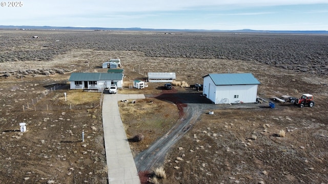 birds eye view of property with a rural view