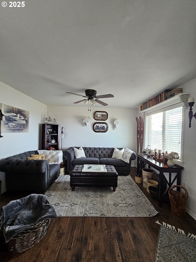 living room with a textured ceiling, hardwood / wood-style floors, and ceiling fan