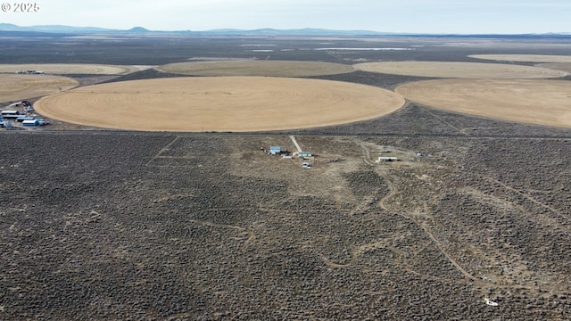 drone / aerial view featuring a mountain view