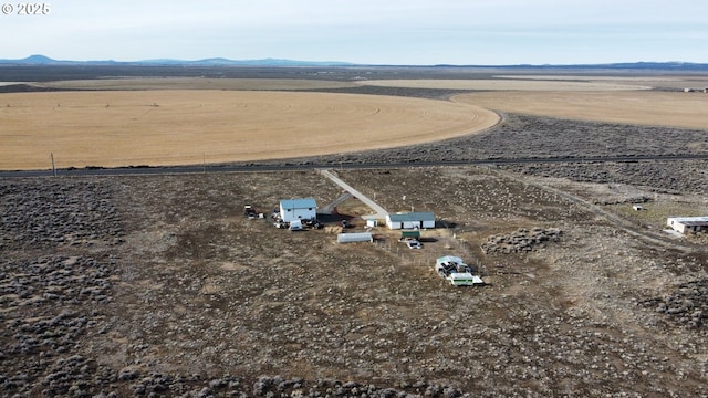 drone / aerial view with a rural view and a mountain view