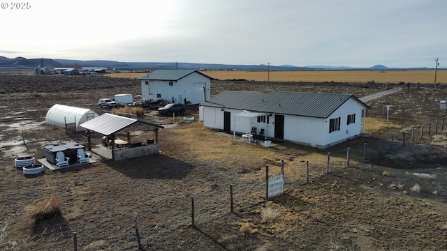 aerial view featuring a rural view and a mountain view