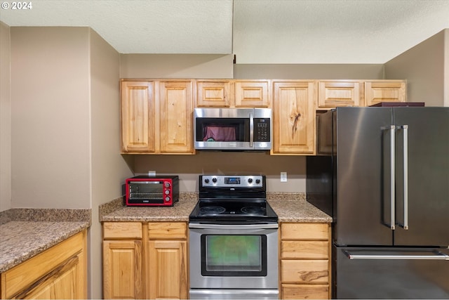 415 Spruce Creek Rd, Longview, WA 98632 - kitchen featuring light countertops, light brown cabinets, appliances with stainless steel finishes, and a toaster