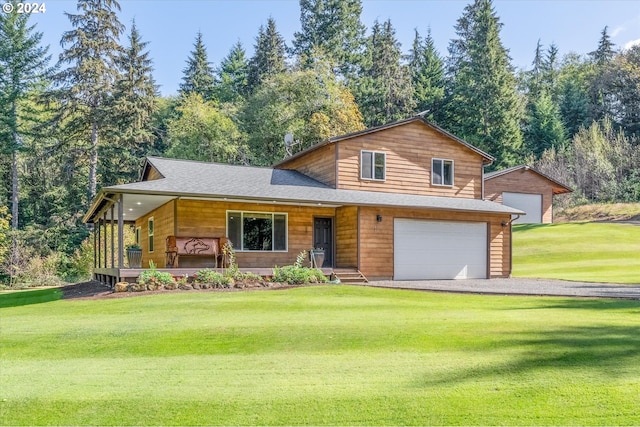 415 Spruce Creek Rd, Longview, WA 98632 - view of front facade featuring covered porch, driveway, a front yard, an attached garage, and a shingled roof