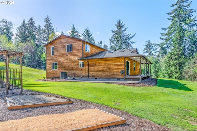 415 Spruce Creek Rd, Longview, WA 98632 - back of property with a shingled roof, a yard, central AC, and a pergola