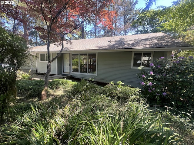 3663 Wilshire Ln, Eugene, OR 97405 - back of house featuring roof with shingles