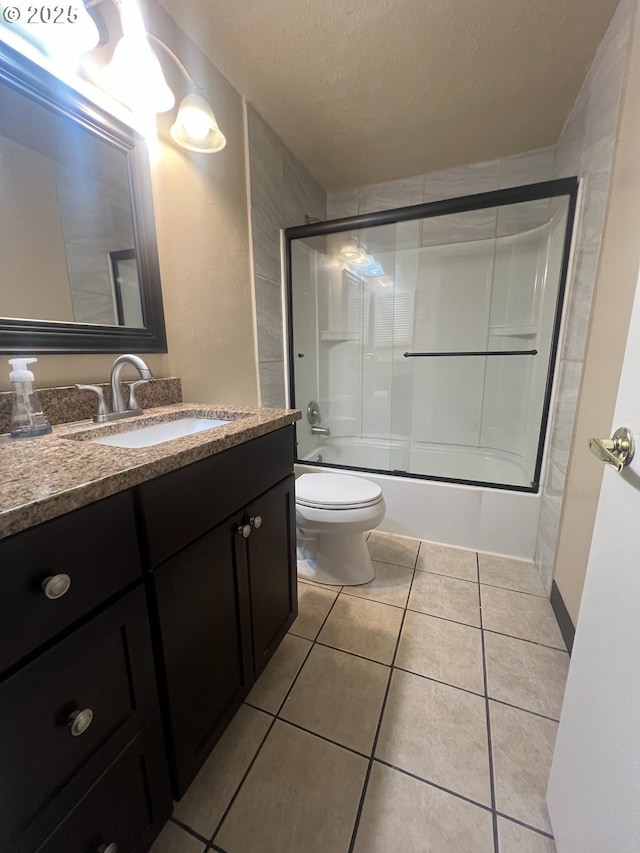 3663 Wilshire Ln, Eugene, OR 97405 - full bath featuring vanity, tile patterned flooring, toilet, combined bath / shower with glass door, and a textured ceiling