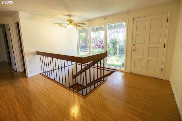 3663 Wilshire Ln, Eugene, OR 97405 - staircase with wood finished floors, baseboards, and ceiling fan