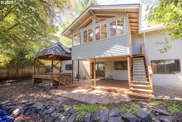 3663 Wilshire Ln, Eugene, OR 97405 - back of house with a gazebo, fence, stairs, a patio area, and a jacuzzi