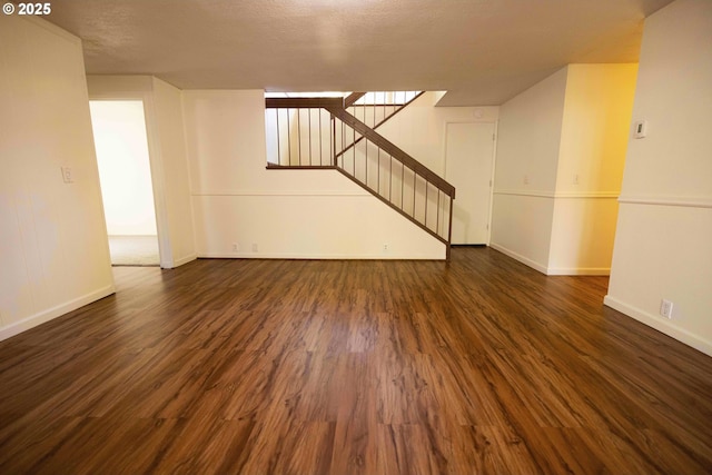 3663 Wilshire Ln, Eugene, OR 97405 - unfurnished living room featuring stairway, dark wood-style floors, and baseboards