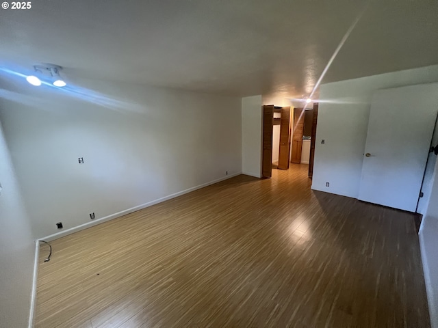 3663 Wilshire Ln, Eugene, OR 97405 - spare room featuring wood finished floors and baseboards