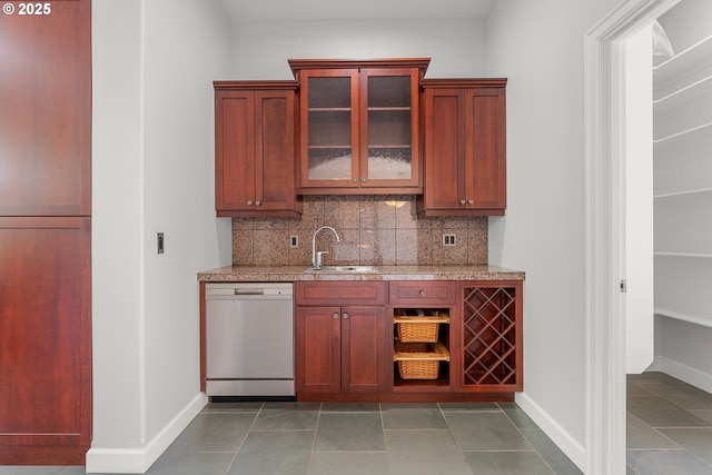 370 NW 81st Pl, Portland, OR 97229 - bar with white dishwasher, decorative backsplash, a sink, and baseboards