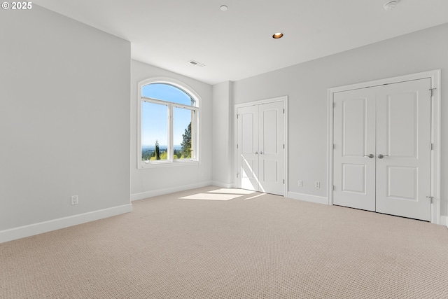 370 NW 81st Pl, Portland, OR 97229 - unfurnished bedroom featuring baseboards, carpet, multiple closets, and recessed lighting
