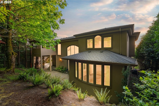 370 NW 81st Pl, Portland, OR 97229 - back of house featuring stucco siding and a shingled roof