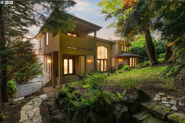 370 NW 81st Pl, Portland, OR 97229 - back of property at dusk featuring french doors and stucco siding