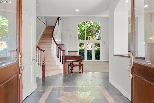 370 NW 81st Pl, Portland, OR 97229 - foyer with stairway, inlaid floor details, plenty of natural light, and recessed lighting