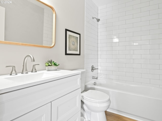 5325 NE Flanders St, Portland, OR 97213 - bathroom with vanity, toilet, washtub / shower combination, and wood finished floors