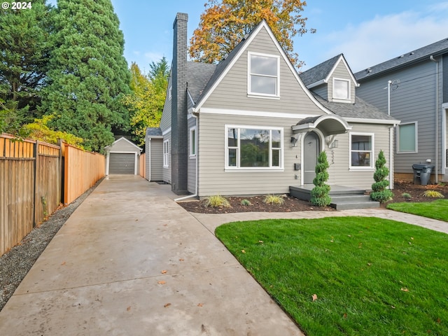 5325 NE Flanders St, Portland, OR 97213 - bungalow-style house featuring concrete driveway, an outbuilding, a detached garage, a chimney, and a shingled roof