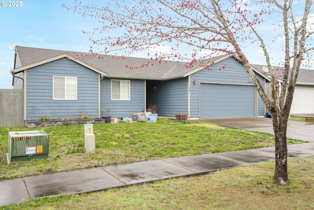 ranch-style home with fence, an attached garage, a shingled roof, a front lawn, and concrete driveway