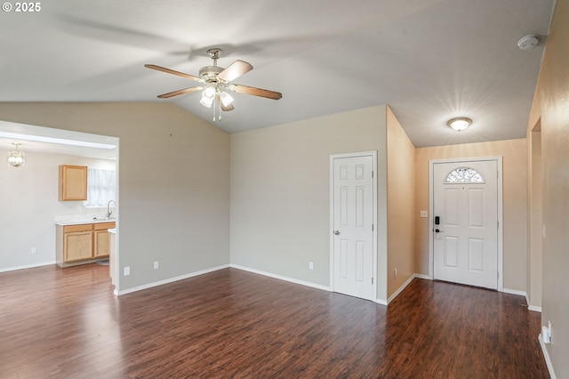 entrance foyer with dark wood-style floors, baseboards, a ceiling fan, and lofted ceiling