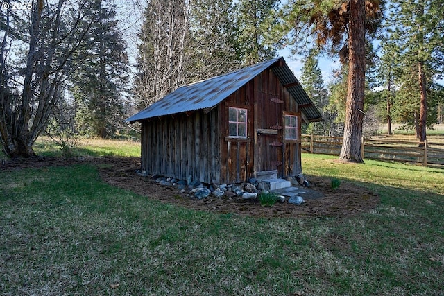 view of shed featuring fence
