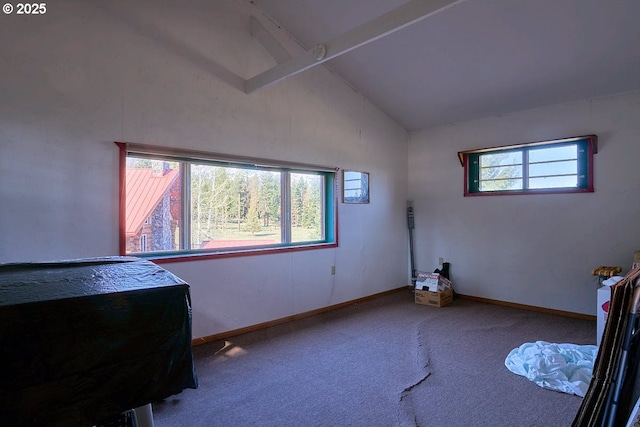 bedroom with vaulted ceiling, carpet flooring, and baseboards