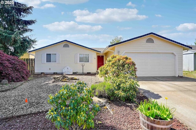5219 Lacey Ct N, Keizer, OR 97303 - ranch-style house featuring fence, concrete driveway, and a garage