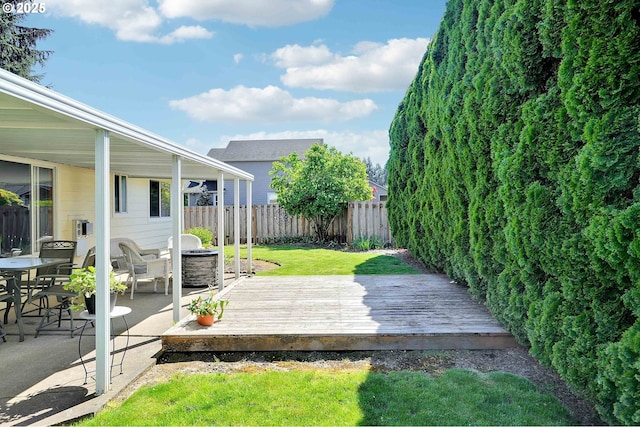 5219 Lacey Ct N, Keizer, OR 97303 - view of yard featuring a fenced backyard, a wooden deck, and a patio area