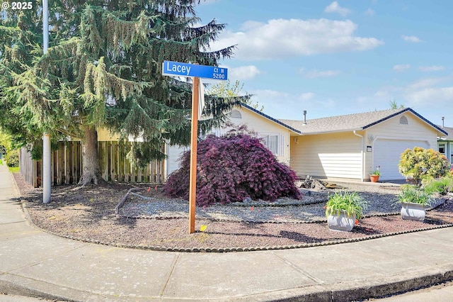 5219 Lacey Ct N, Keizer, OR 97303 - view of front of property featuring an attached garage and fence