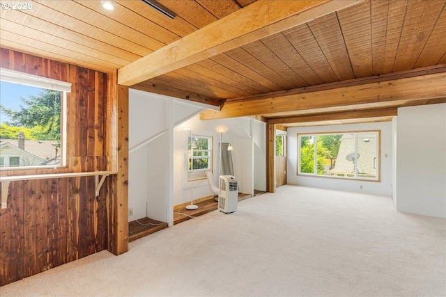 1824 NE 52nd Ave, Portland, OR 97213 - carpeted empty room featuring a wood ceiling with exposed beams, plenty of natural light, and wood walls