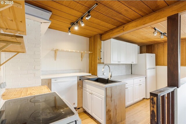 1824 NE 52nd Ave, Portland, OR 97213 - kitchen with rail lighting, white appliances, white cabinets, light wood-type flooring, and wooden ceiling