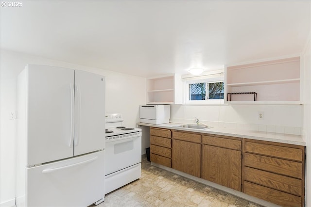 1824 NE 52nd Ave, Portland, OR 97213 - kitchen with white appliances, open shelves, brown cabinetry, and light countertops