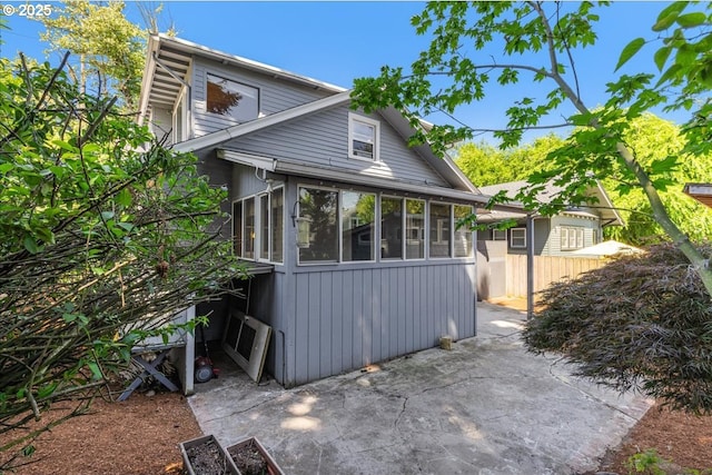 1824 NE 52nd Ave, Portland, OR 97213 - back of property with a patio area and a sunroom