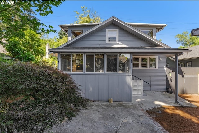 1824 NE 52nd Ave, Portland, OR 97213 - back of property with a patio area, a sunroom, and roof with shingles