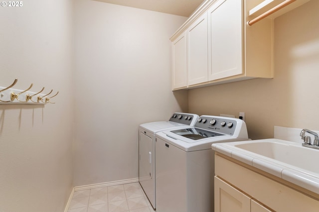 13581 SW Essex Dr, Portland, OR 97223 - clothes washing area featuring cabinet space, separate washer and dryer, and baseboards