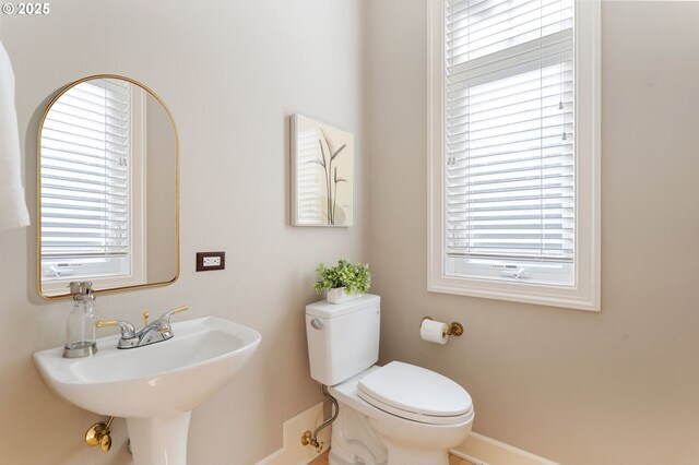 13581 SW Essex Dr, Portland, OR 97223 - bathroom with toilet, baseboards, and a sink