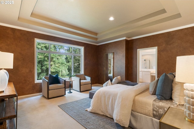 13581 SW Essex Dr, Portland, OR 97223 - carpeted bedroom featuring a tray ceiling, ensuite bathroom, baseboards, and ornamental molding